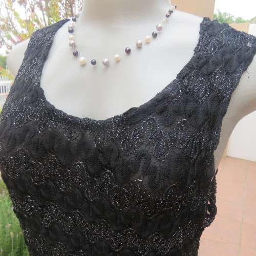 Glamour sleeveless black and silver horizontal patterned see-through top. Lined to waist. Size 34