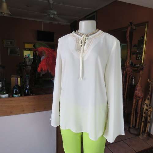 Stylish rich cream slip over long sleeve top size 38/14 with pretty embroidered neckline.By STATURE.