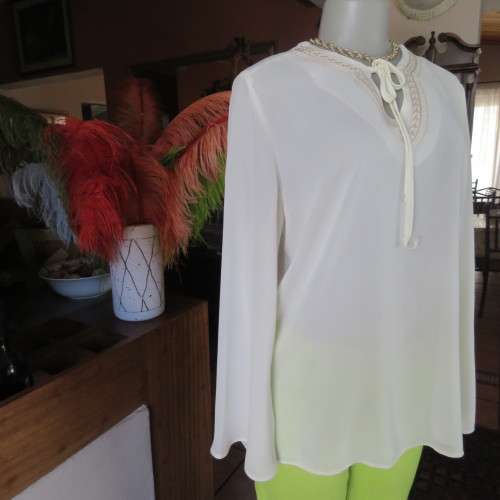 Stylish rich cream slip over long sleeve top size 38/14 with pretty embroidered neckline.By STATURE.