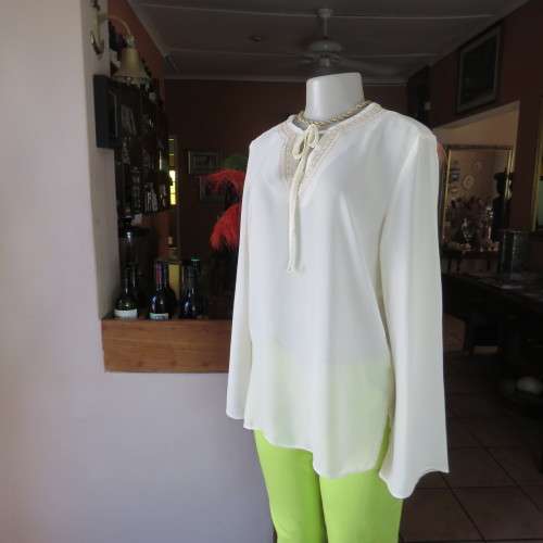 Stylish rich cream slip over long sleeve top size 38/14 with pretty embroidered neckline.By STATURE.