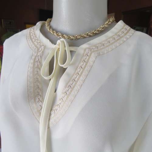 Stylish rich cream slip over long sleeve top size 38/14 with pretty embroidered neckline.By STATURE.