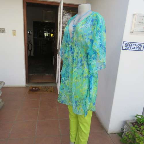 Cheerful sheer polyester long loose top in greens and blue tasteful patterns. Size 40/16. As new