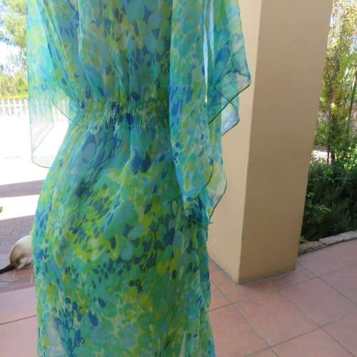 Cheerful sheer polyester long loose top in greens and blue tasteful patterns. Size 40/16. As new