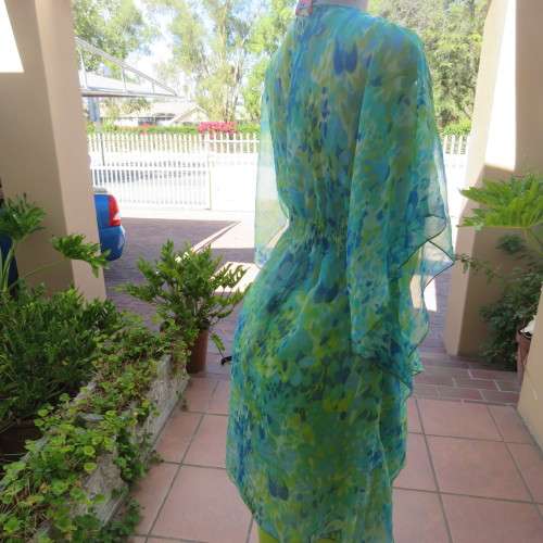 Cheerful sheer polyester long loose top in greens and blue tasteful patterns. Size 40/16. As new