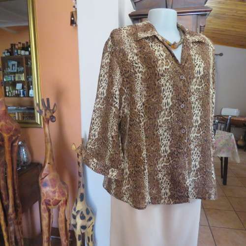 Animal print button down top in browns and cream with open collar. By TLC in size 40/16.As new