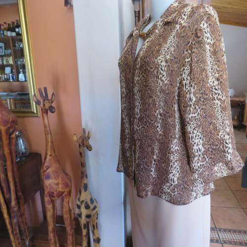 Animal print button down top in browns and cream with open collar. By TLC in size 40/16.As new