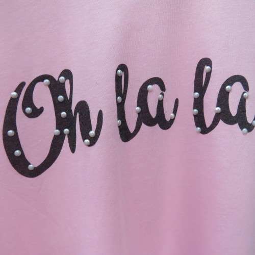 Pretty carnation pink capped sleeve slip over top with asymmetrical seamline. For 14 to 15 yr old.