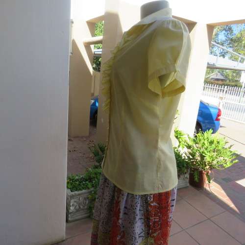 Feminine lemon yellow button down capped sleeve top with frilled front.Open round end collar.Size 38