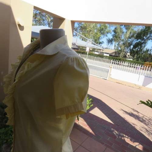 Feminine lemon yellow button down capped sleeve top with frilled front.Open round end collar.Size 38