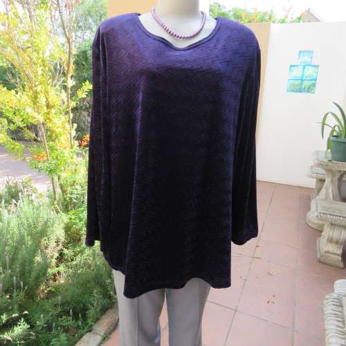 Dark purple loose hanging long sleeve polyester velvet top by DONNA CLAIRE size 48/24.