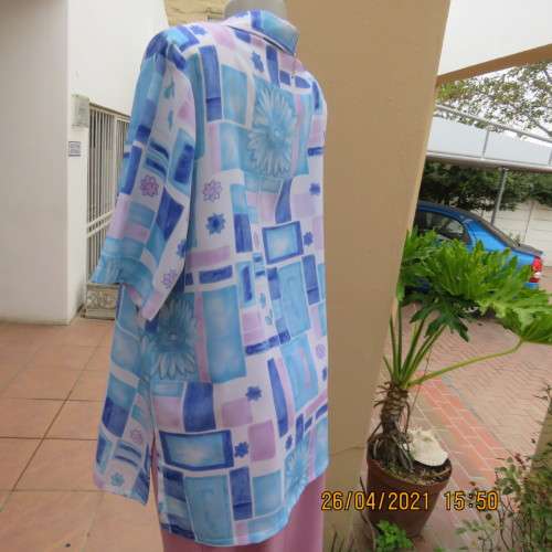 Boutique made short sleeve button down blue/pink blocks/flowers on white background. Size 42 to 44