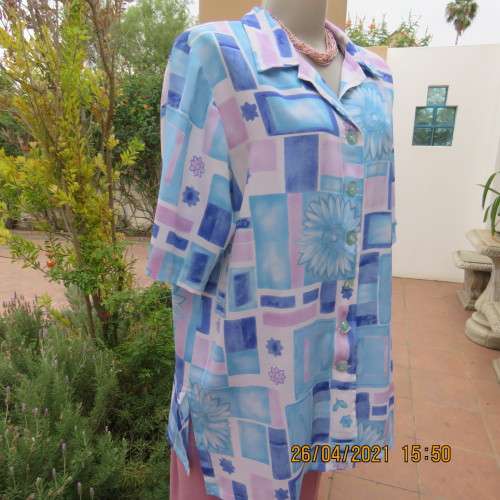 Boutique made short sleeve button down blue/pink blocks/flowers on white background. Size 42 to 44