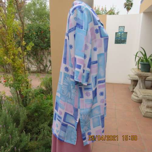 Boutique made short sleeve button down blue/pink blocks/flowers on white background. Size 42 to 44