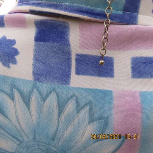 Boutique made short sleeve button down blue/pink blocks/flowers on white background. Size 42 to 44