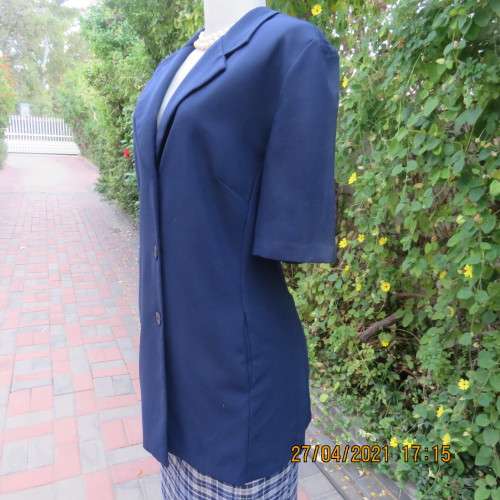 Smart navy tailored jacket with 3 buttons on front.Open collar. Slit seam pockets.Size 42/18.New con
