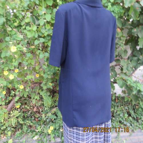 Smart navy tailored jacket with 3 buttons on front.Open collar. Slit seam pockets.Size 42/18.New con
