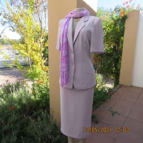 Suits Amazing 2 pc skirt suit in soft lilac.Tailored short sleeve jacket and pencil skirt.Size 32 8.WOOLW. was listed for 0.00 on 7 Sep at 11 31 by trendyvintage191 in Oudtshoorn ID 593113981