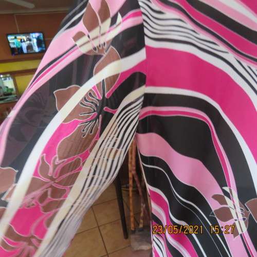 Get noticed in this top with diagonal patterned lines in pinks/black and white. By DONATELLA size 48