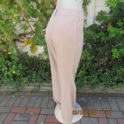 Elegant latte beige pants from WOOLWORTHS size 34/10 with space.Straight legs.Good condition.