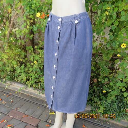 Durable blue denim button down skirt in heavy cotton.Pleats on front.Elasticated back. Size 36 to 38