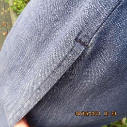 Durable blue denim button down skirt in heavy cotton.Pleats on front.Elasticated back. Size 36 to 38