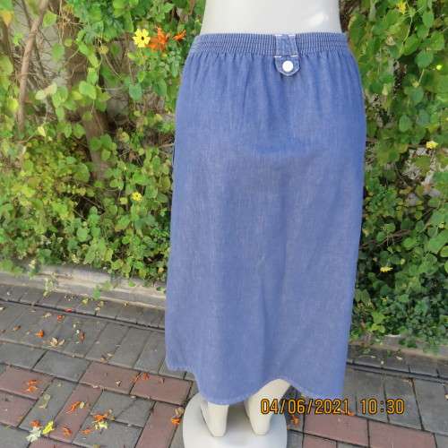 Durable blue denim button down skirt in heavy cotton.Pleats on front.Elasticated back. Size 36 to 38