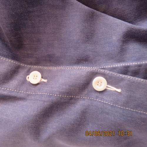 Durable blue denim button down skirt in heavy cotton.Pleats on front.Elasticated back. Size 36 to 38
