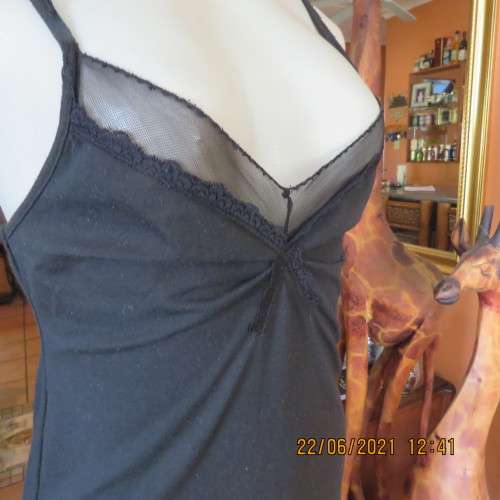 Lovely easy to wear black stretch polycotton under knee length petticoat. Adjustable straps.Size 34