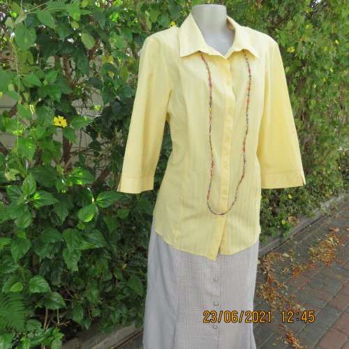 Trendy buttercup yellow button down top with embossed stripes size 42/18.Elbow length sleeves.As new