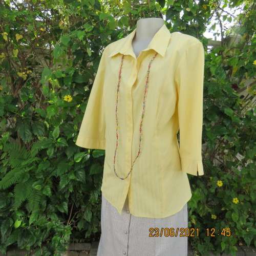 Trendy buttercup yellow button down top with embossed stripes size 42/18.Elbow length sleeves.As new