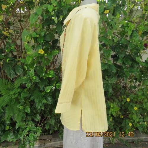 Trendy buttercup yellow button down top with embossed stripes size 42/18.Elbow length sleeves.As new