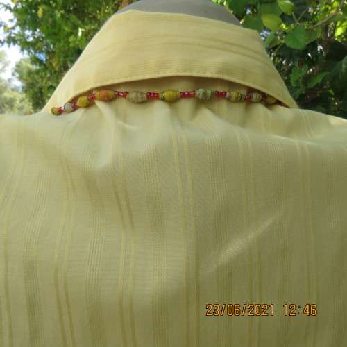 Trendy buttercup yellow button down top with embossed stripes size 42/18.Elbow length sleeves.As new