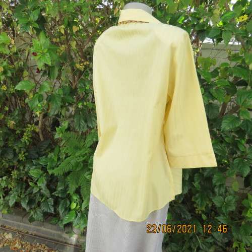 Trendy buttercup yellow button down top with embossed stripes size 42/18.Elbow length sleeves.As new