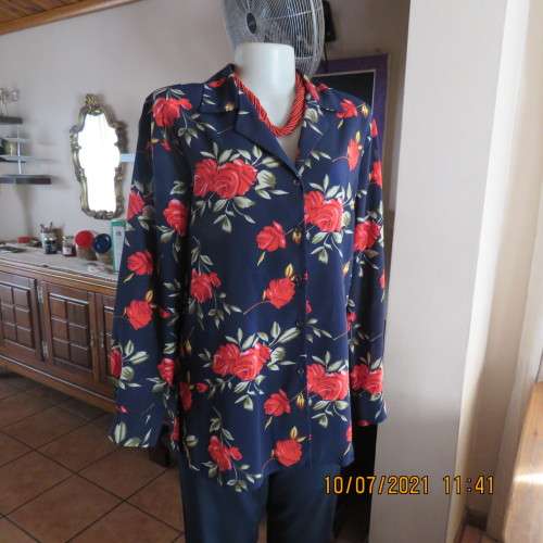 High quality AREZZO long sleeve top in navy with red roses/green leaves.Size 40/16.As new