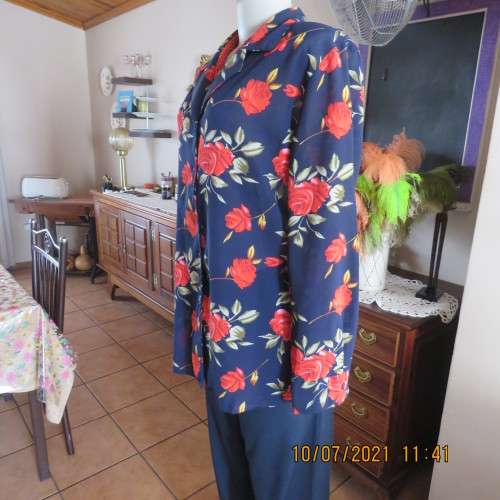 High quality AREZZO long sleeve top in navy with red roses/green leaves.Size 40/16.As new