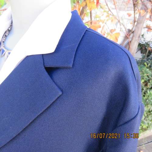 Smart navy DONNA CLAIRE long sleeve jacket size 48/24 in heavy polyester. New condition.