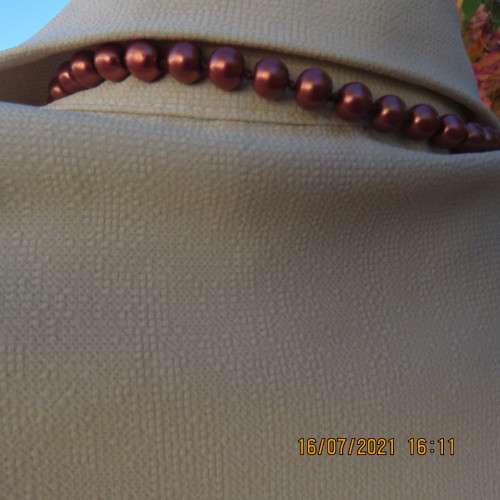 Stylish rich cream button down top in textured polyester.With flare sleeve cuffs. Size 42/18. As new