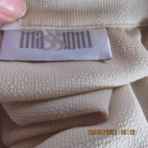 Stylish rich cream button down top in textured polyester.With flare sleeve cuffs. Size 42/18. As new