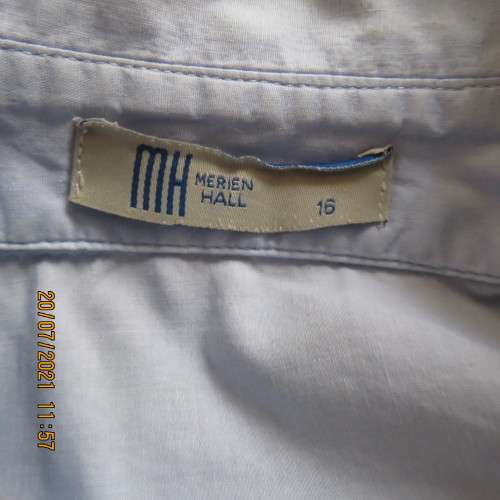 High quality powder blue button down top with tasteful floral front embroidery. Size 38 to 40.By M H