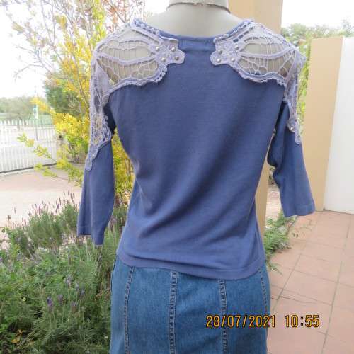 Dainty cobalt blue polycotton knit button down top.Cotton lace yokes and shoulders.Size 36/12