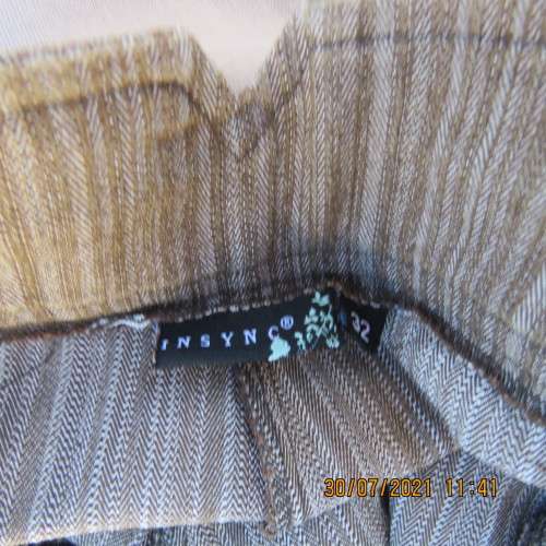 Classic light brown striped cropped pants in firm polycotton stretch fabric.Size 32/8. As new.