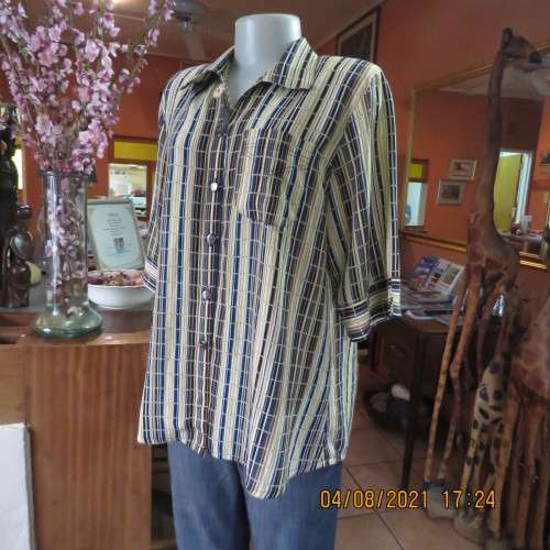 Smart cream,caramel and blue checked short sleeve top size 40 to 42.Viscose/cotton and poly blend.