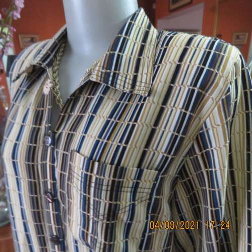 Smart cream,caramel and blue checked short sleeve top size 40 to 42.Viscose/cotton and poly blend.