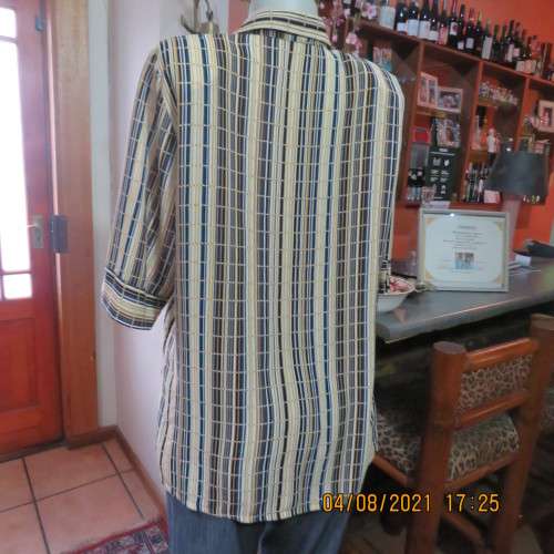 Smart cream,caramel and blue checked short sleeve top size 40 to 42.Viscose/cotton and poly blend.
