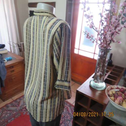 Smart cream,caramel and blue checked short sleeve top size 40 to 42.Viscose/cotton and poly blend.