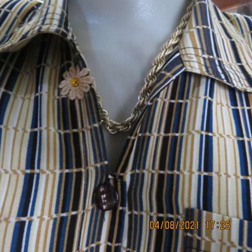 Smart cream,caramel and blue checked short sleeve top size 40 to 42.Viscose/cotton and poly blend.