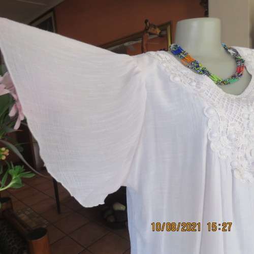 Lovely easy to wear white loose hanging lined embellished  top with bell sleeves size 46/22.As new