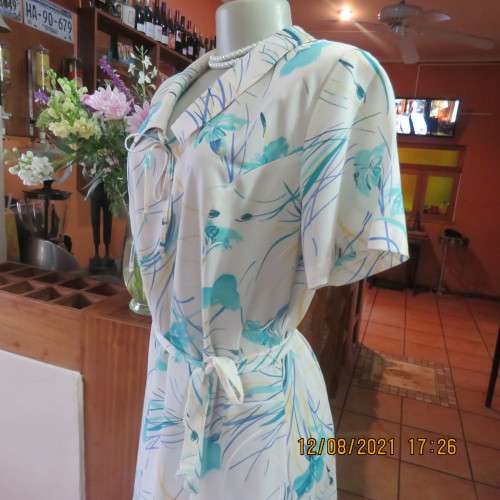 Ageless princess style short sleeve vintage dress by DELSWA size 42/18.White with turquoise flowers.