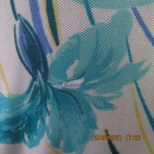 Ageless princess style short sleeve vintage dress by DELSWA size 42/18.White with turquoise flowers.