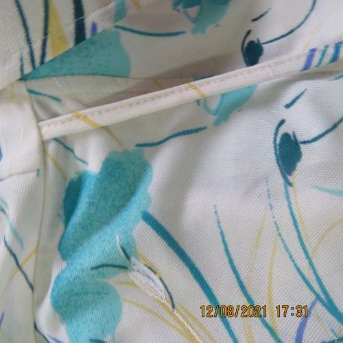 Ageless princess style short sleeve vintage dress by DELSWA size 42/18.White with turquoise flowers.